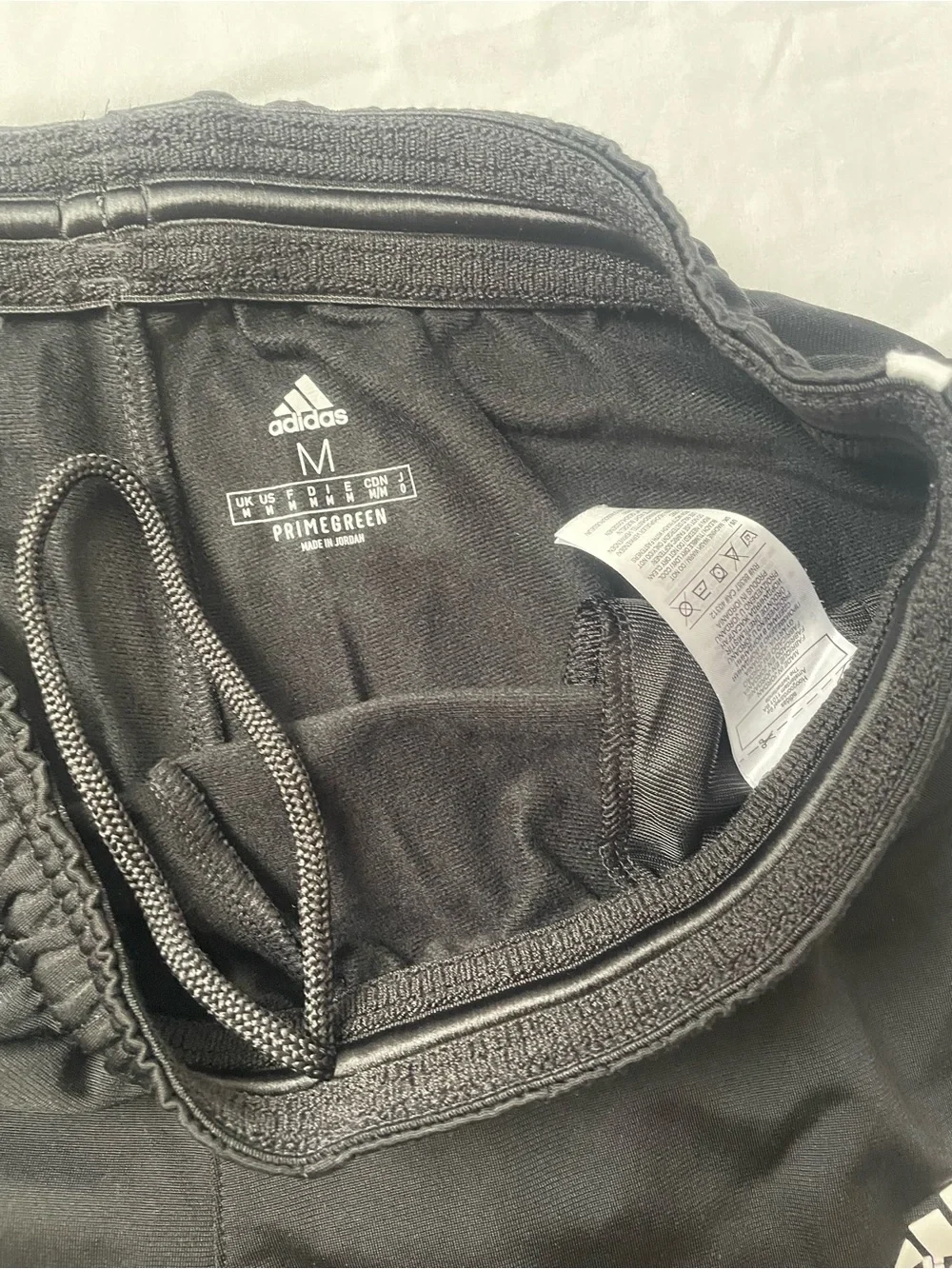 Adidas Vintage Black Track Pants with Classic White Stripes
